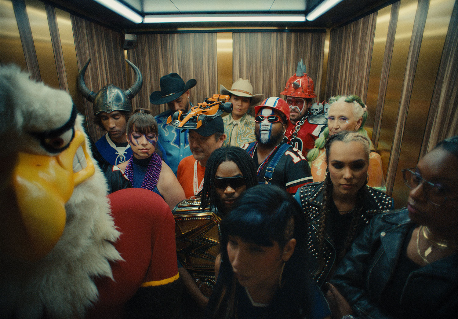 Image of a bunch of people dressed up in costumes in an elevator in Las Vegas